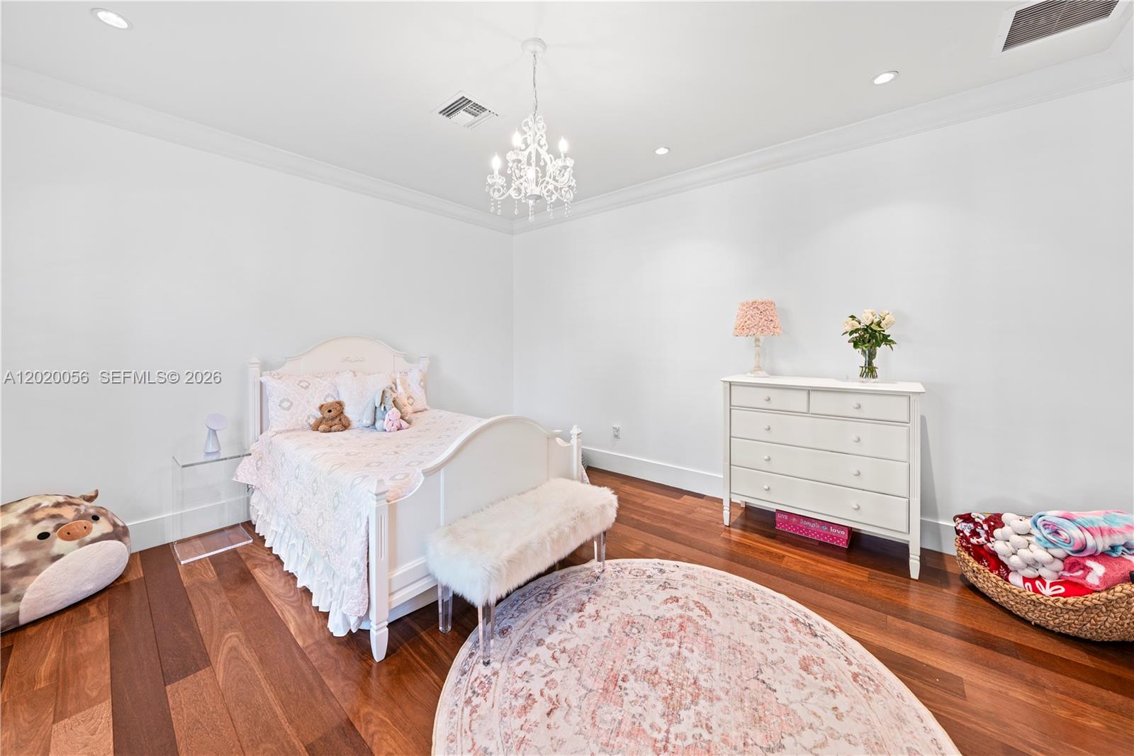 4196 Douglas Road Miami, FL 33133 - Photo 65 of 96 a bedroom with a bed and a dresser