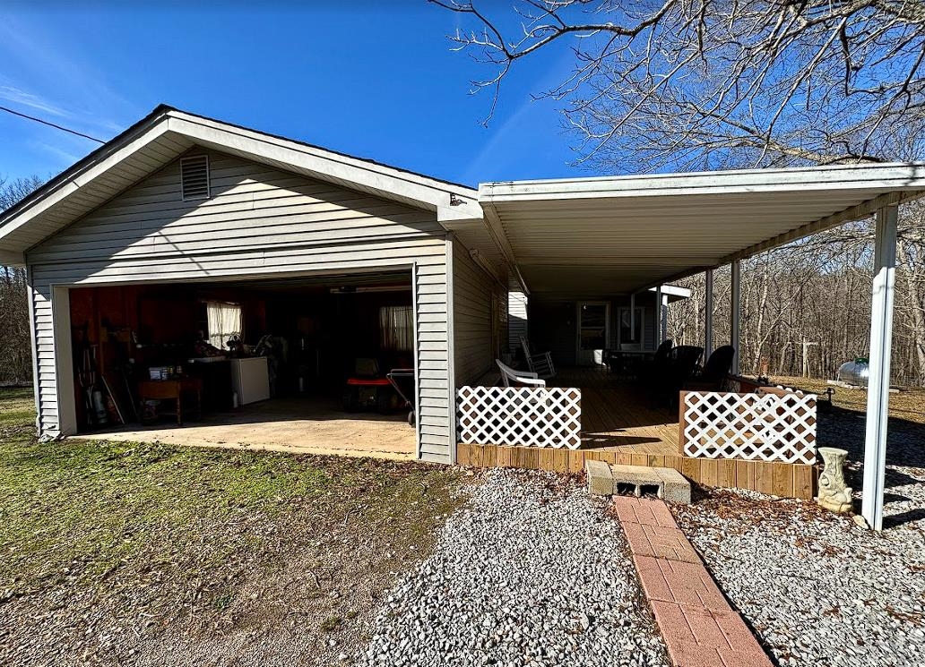 8825 Wolf Pen Road Pocahontas, TN 38061 - Photo 13 of 14 a front view of a house with garden