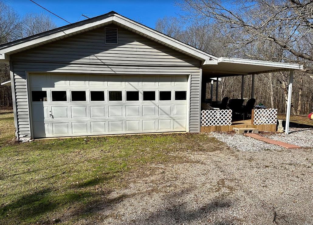 8825 Wolf Pen Road Pocahontas, TN 38061 - Photo 14 of 14 a front view of a house with a yard