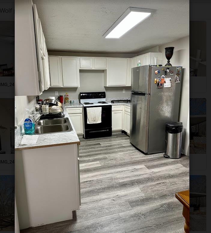 8825 Wolf Pen Road Pocahontas, TN 38061 - Photo 4 of 14 a kitchen with stainless steel appliances kitchen island a refrigerator sink and stove