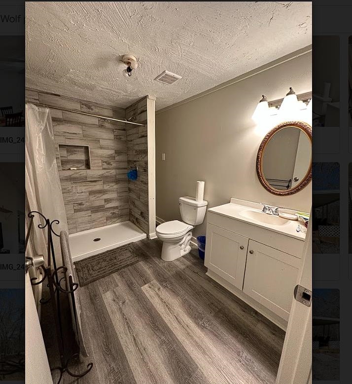 8825 Wolf Pen Road Pocahontas, TN 38061 - Photo 5 of 14 a bathroom with a toilet sink and mirror