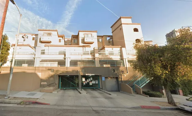 a balcony with table and chairs