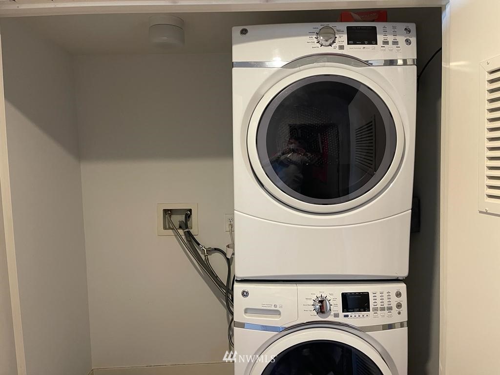 2911 2nd Avenue, Unit 818 Seattle, WA 98121 - Photo 15 of 16 a utility room with dryer and washer