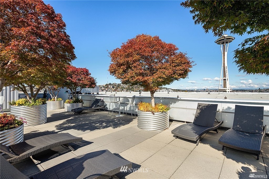 2911 2nd Avenue, Unit 818 Seattle, WA 98121 - Photo 10 of 16 a view of a terrace with furniture and tree