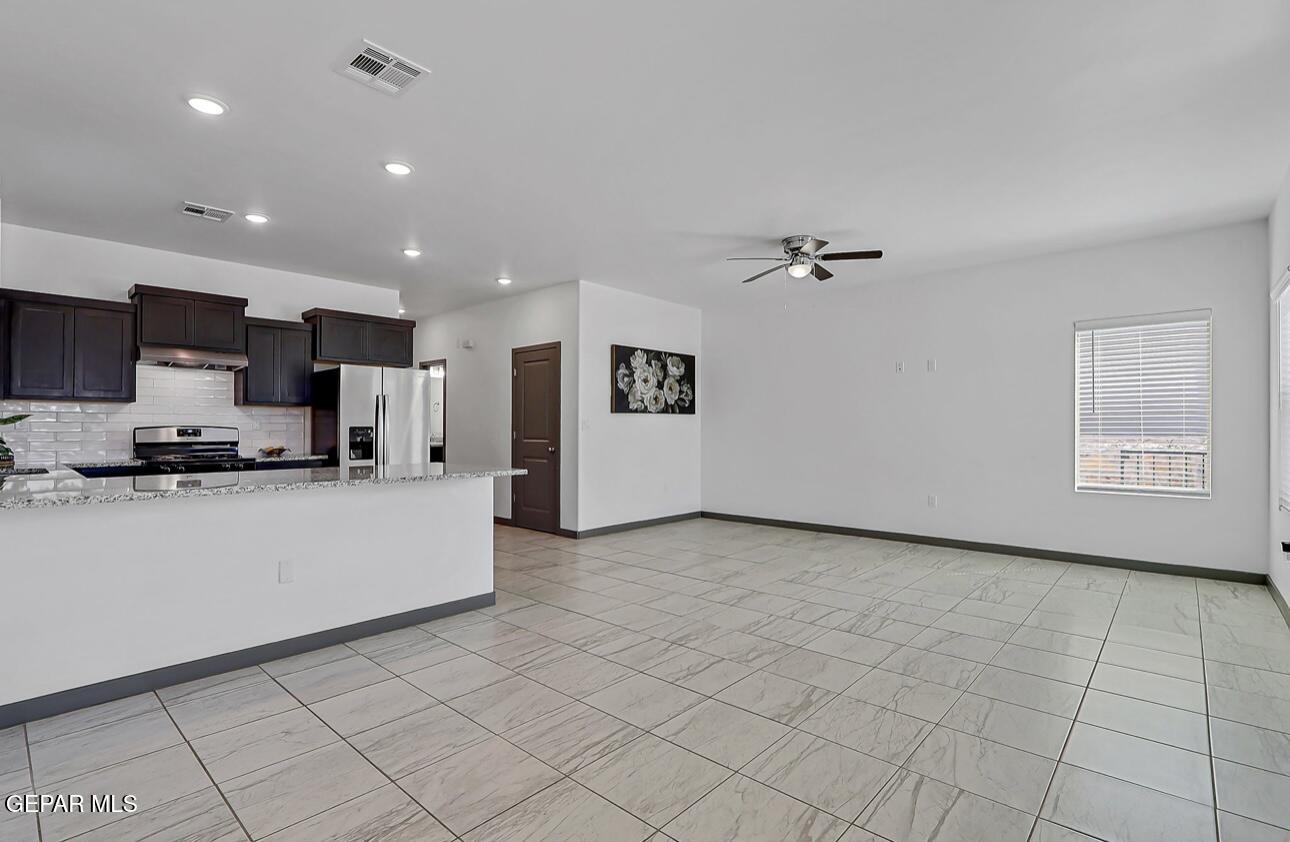 4572 Mark Avizo El Paso, TX 79938 - Photo 11 of 32 a view of a kitchen with furniture and a kitchen