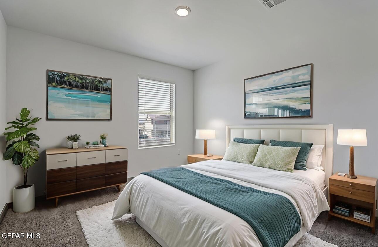 4572 Mark Avizo El Paso, TX 79938 - Photo 25 of 32 a bedroom with a bed and a potted plant