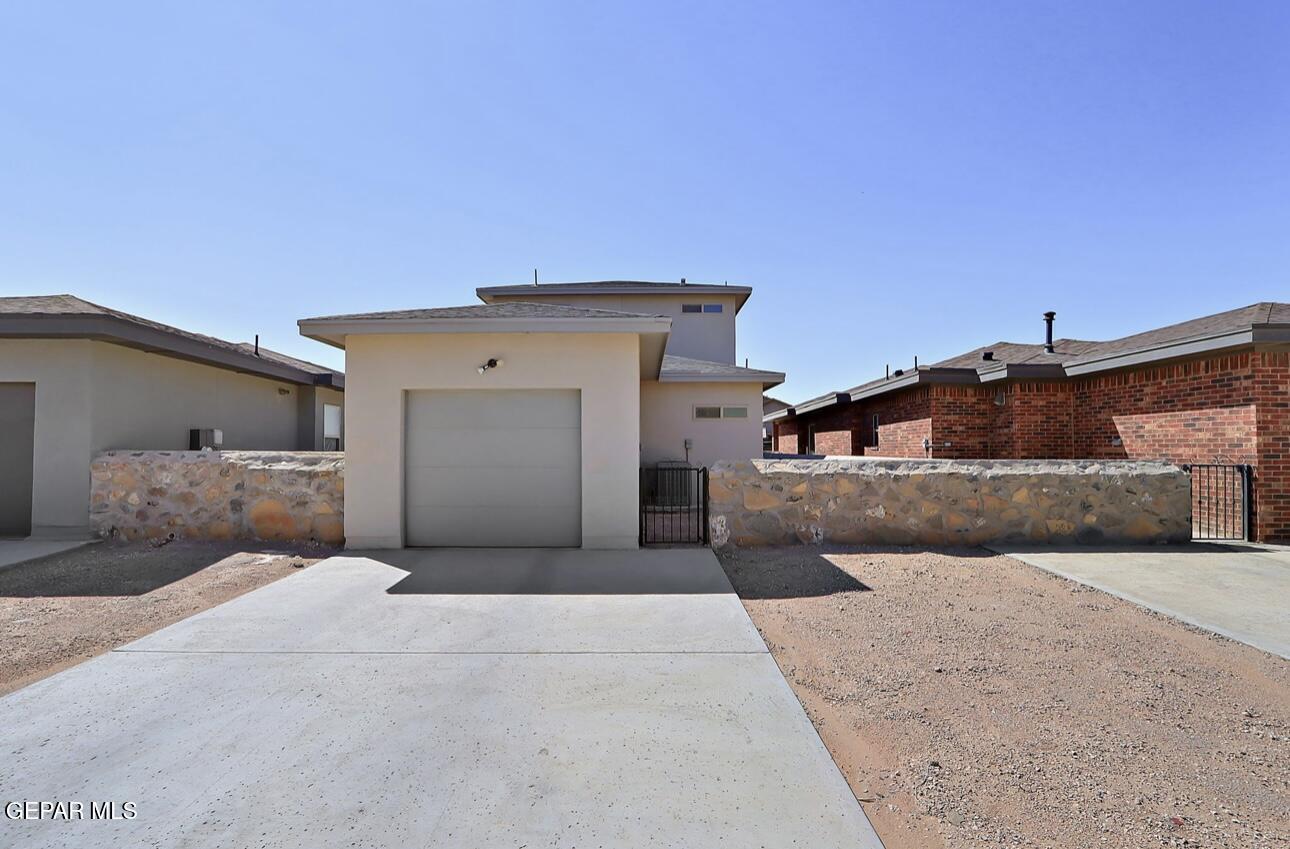 4572 Mark Avizo El Paso, TX 79938 - Photo 27 of 32 a bedroom with a large bed and a couch