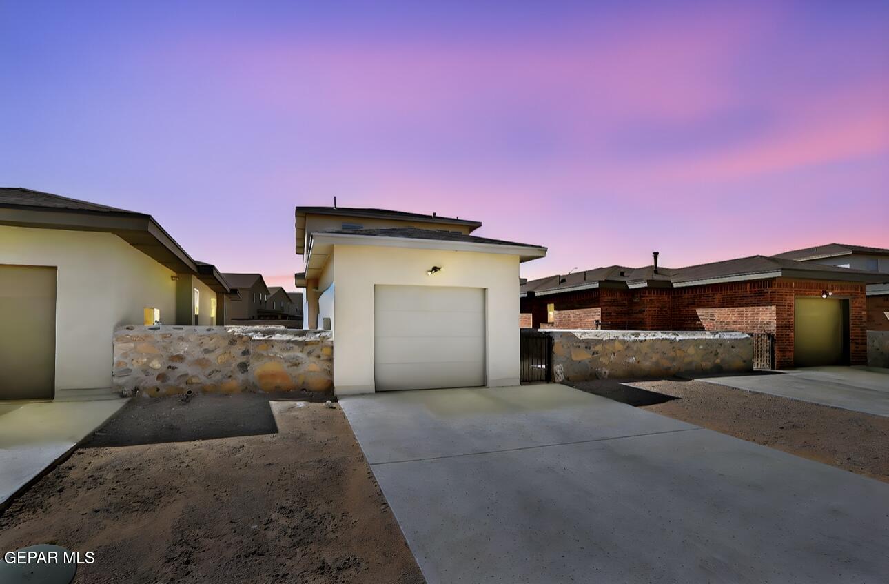 4572 Mark Avizo El Paso, TX 79938 - Photo 28 of 32 a front view of a house with a garage
