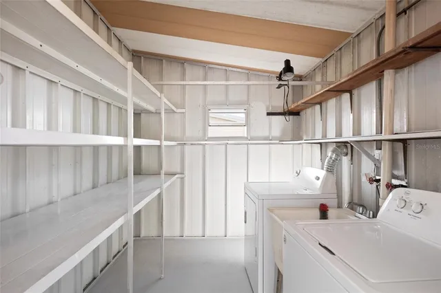a view of a porch with wooden floor and fence