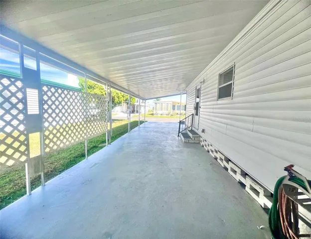 a kitchen with cabinets and chairs