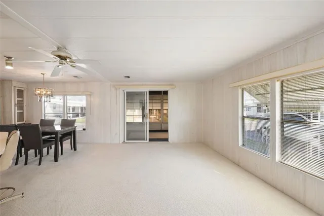 a view of wooden floor and windows in a room