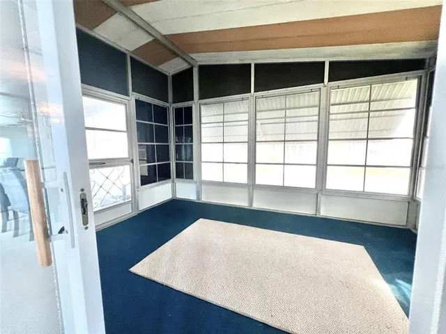 a view of a dining room with furniture and window