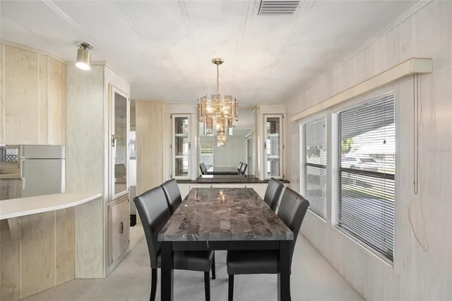 a bathroom with a glass door shower and a sink