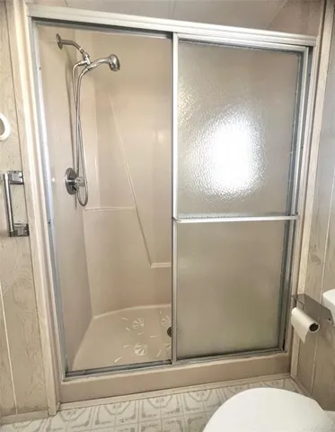a bathroom with a sink toilet and a mirror