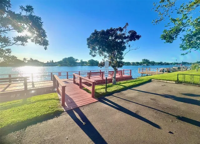 a view of a house with swimming pool and a yard