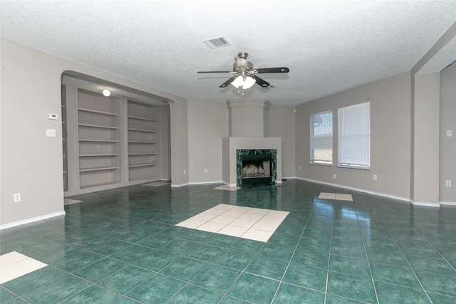 a view of livingroom with furniture and a fireplace