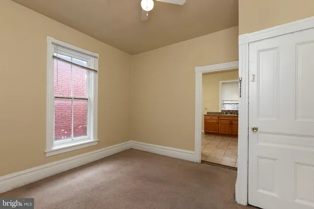 an empty room that has a window