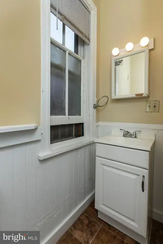 a view of a bathroom with a sink and a mirror