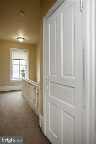 a view of a hallway with windows