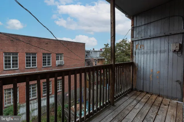 a balcony view with wooden floor