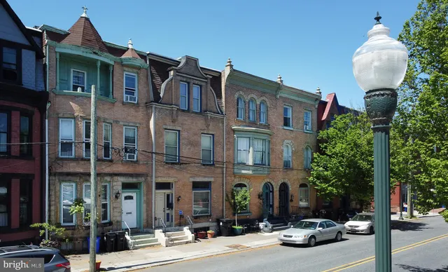 a front view of a building with street view