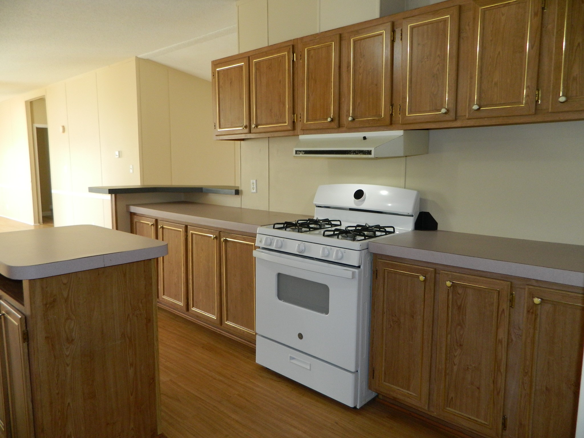 3434-2 Corrolla Magnolia, TX 77354 - Photo 11 of 40 a kitchen with stainless steel appliances granite countertop a stove a sink and a refrigerator