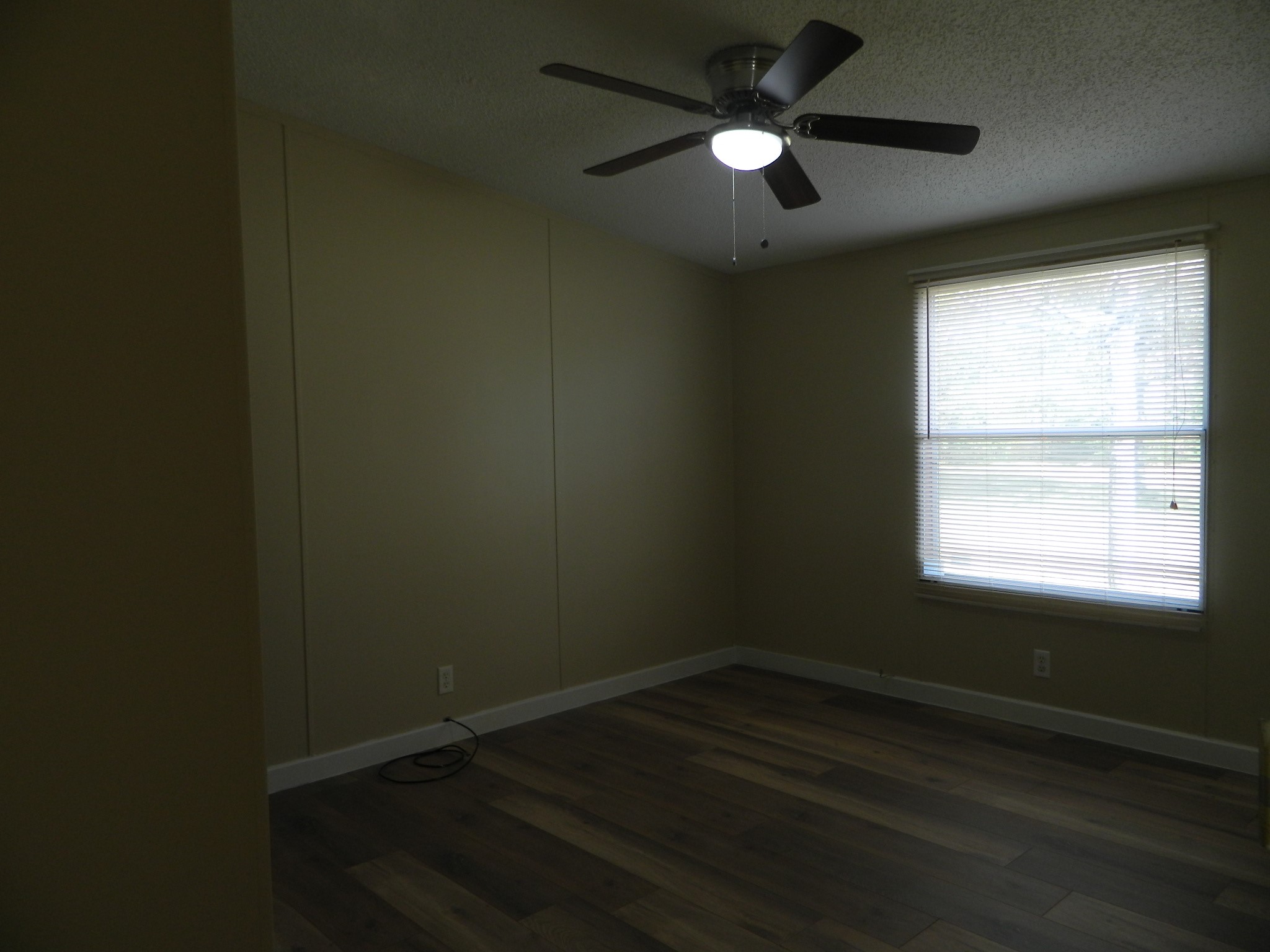 3434-2 Corrolla Magnolia, TX 77354 - Photo 14 of 40 an empty room with wooden floor and windows