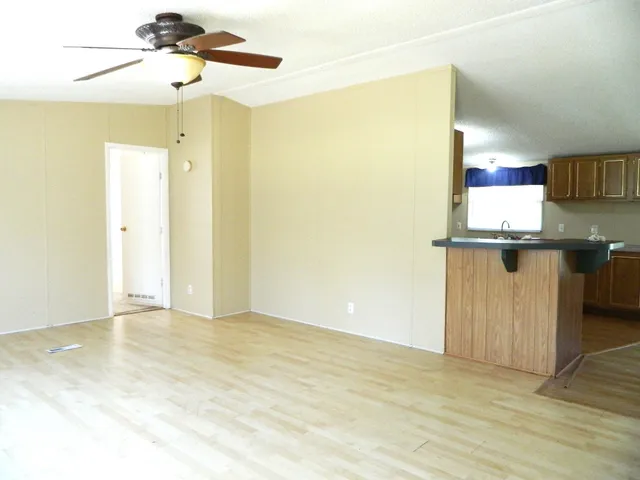 a kitchen with sink cabinets and window
