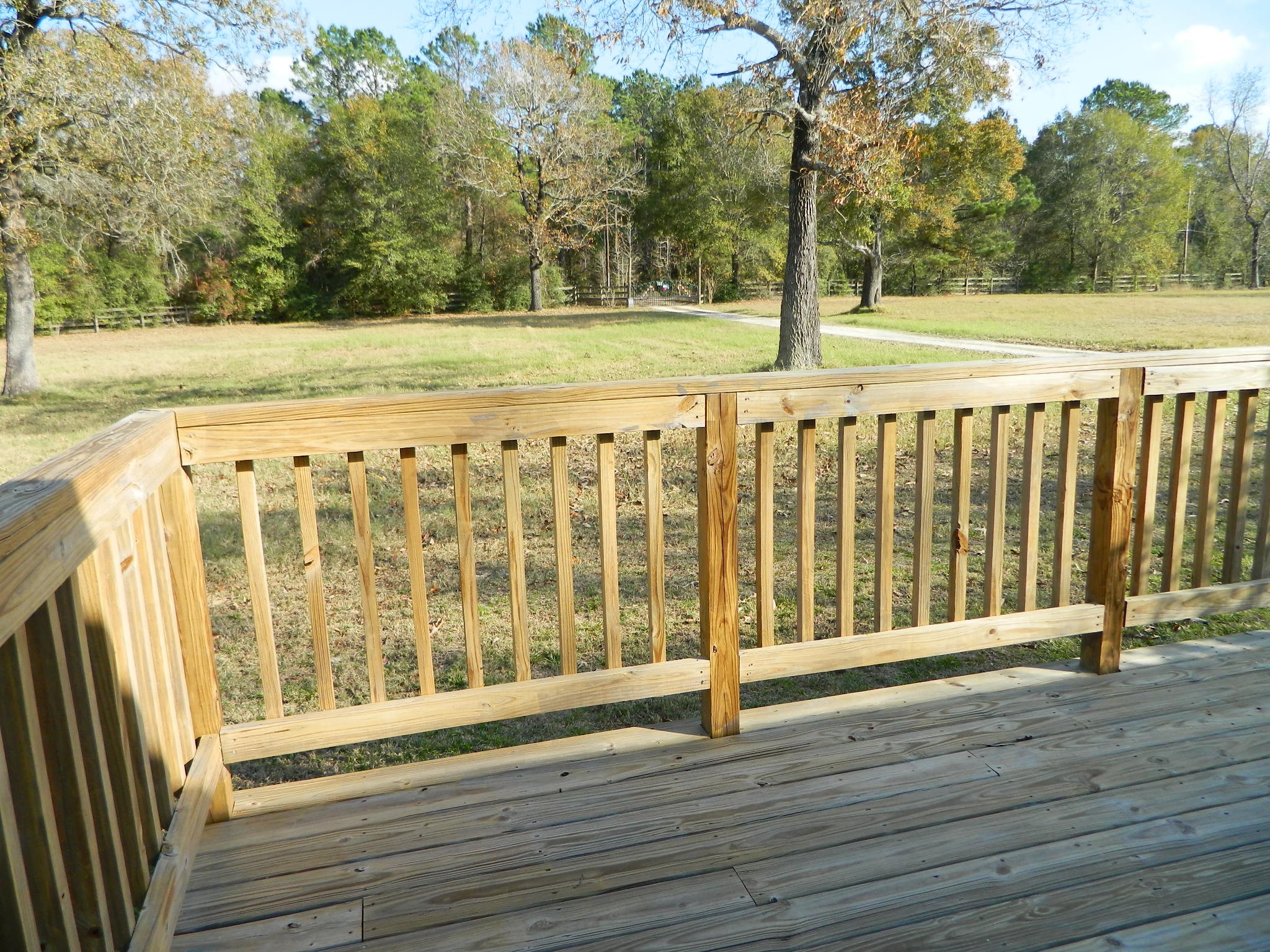 3434-2 Corrolla Magnolia, TX 77354 - Photo 24 of 40 a view of a deck with wooden floor and fence