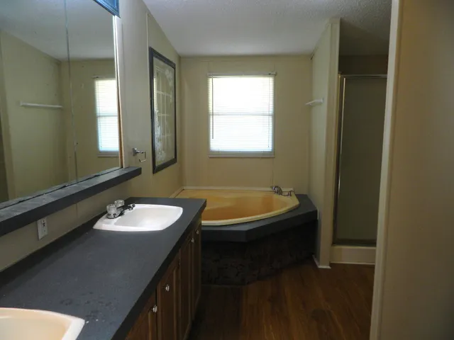 a view of a bathroom from a hallway