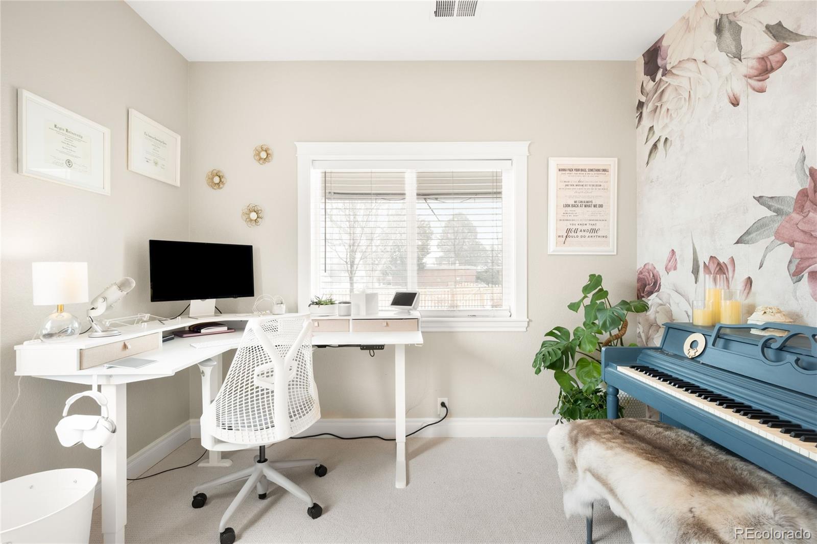 3017 Steele Street Denver, CO 80205 - Photo 16 of 36 a work room with furniture and a flat screen tv
