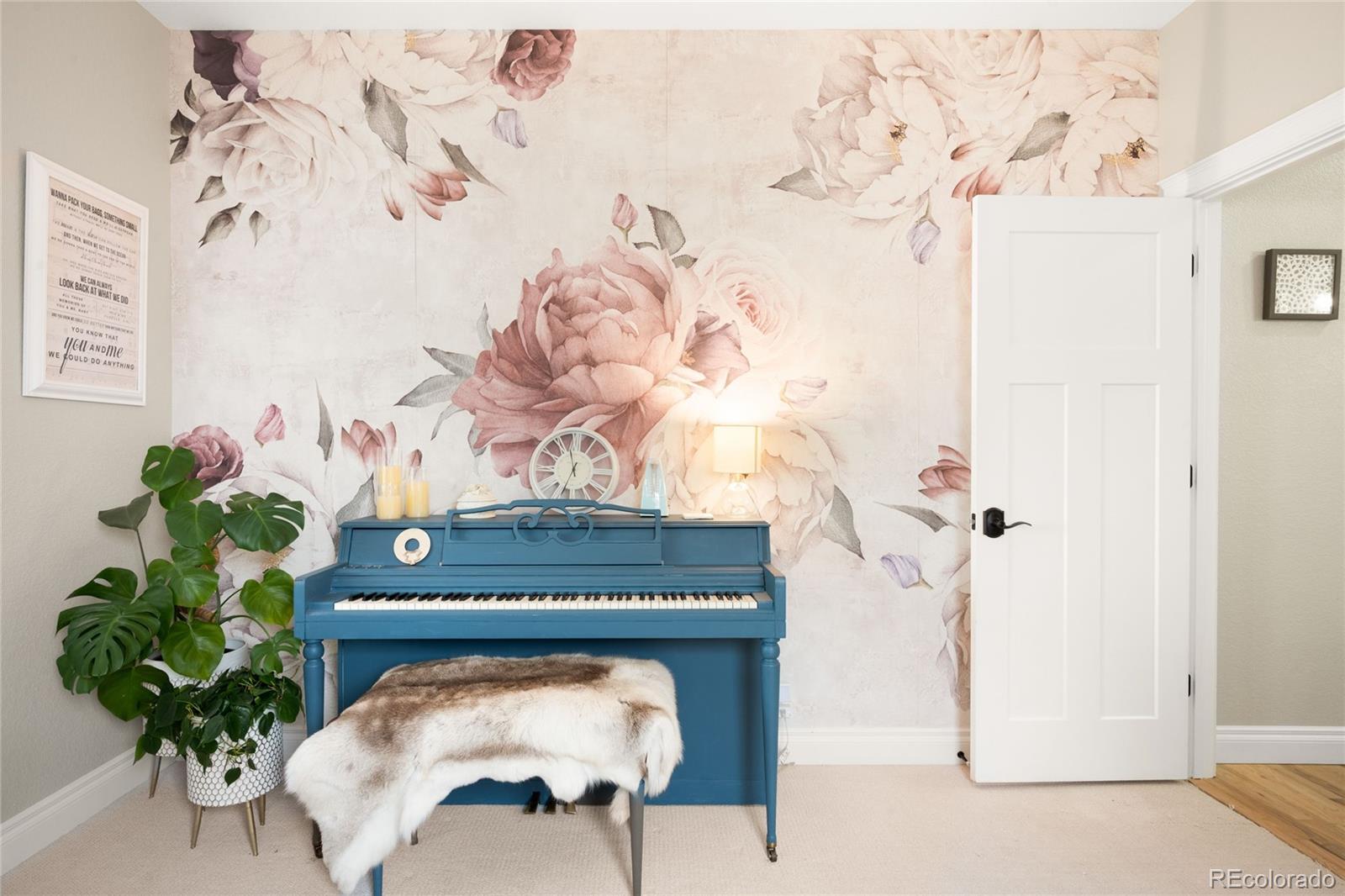 3017 Steele Street Denver, CO 80205 - Photo 17 of 36 a living room with furniture and a potted plant