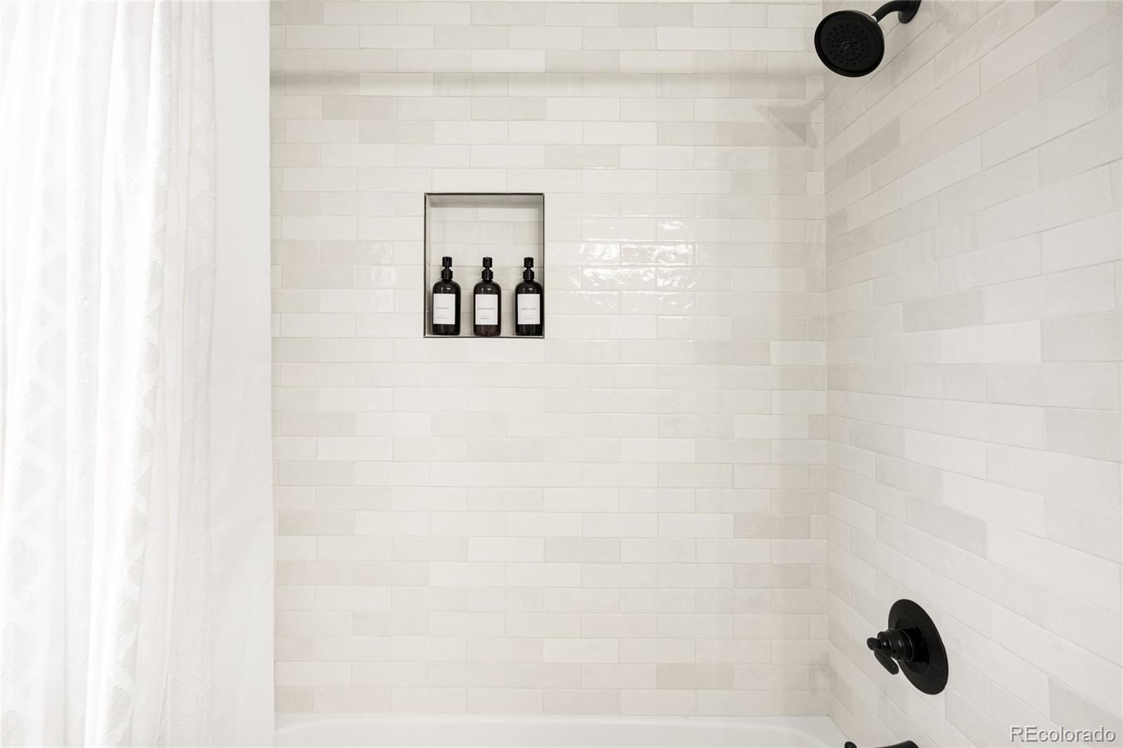 3017 Steele Street Denver, CO 80205 - Photo 22 of 36 a bathroom with a shower