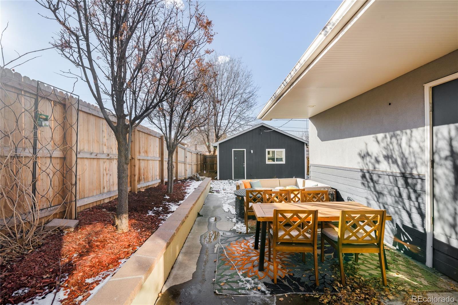 3017 Steele Street Denver, CO 80205 - Photo 27 of 36 a view of a chairs and table in the patio