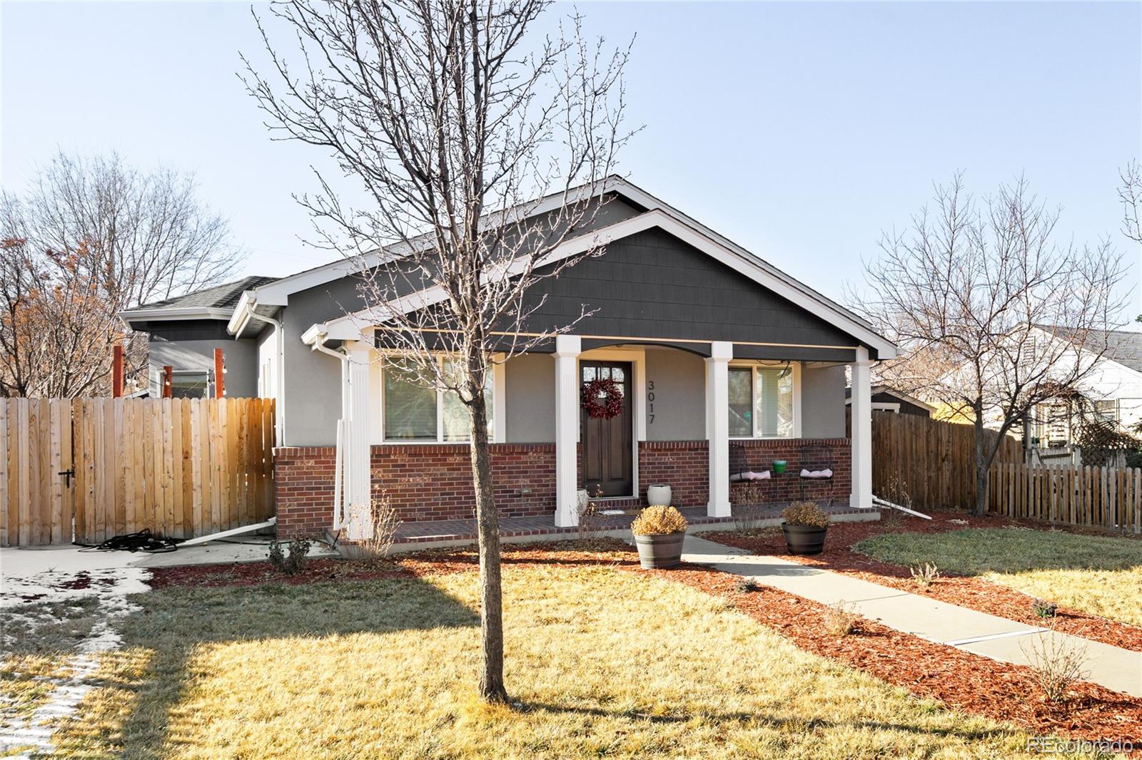 3017 Steele Street Denver, CO 80205 - Photo 28 of 36 a front view of a house with a patio