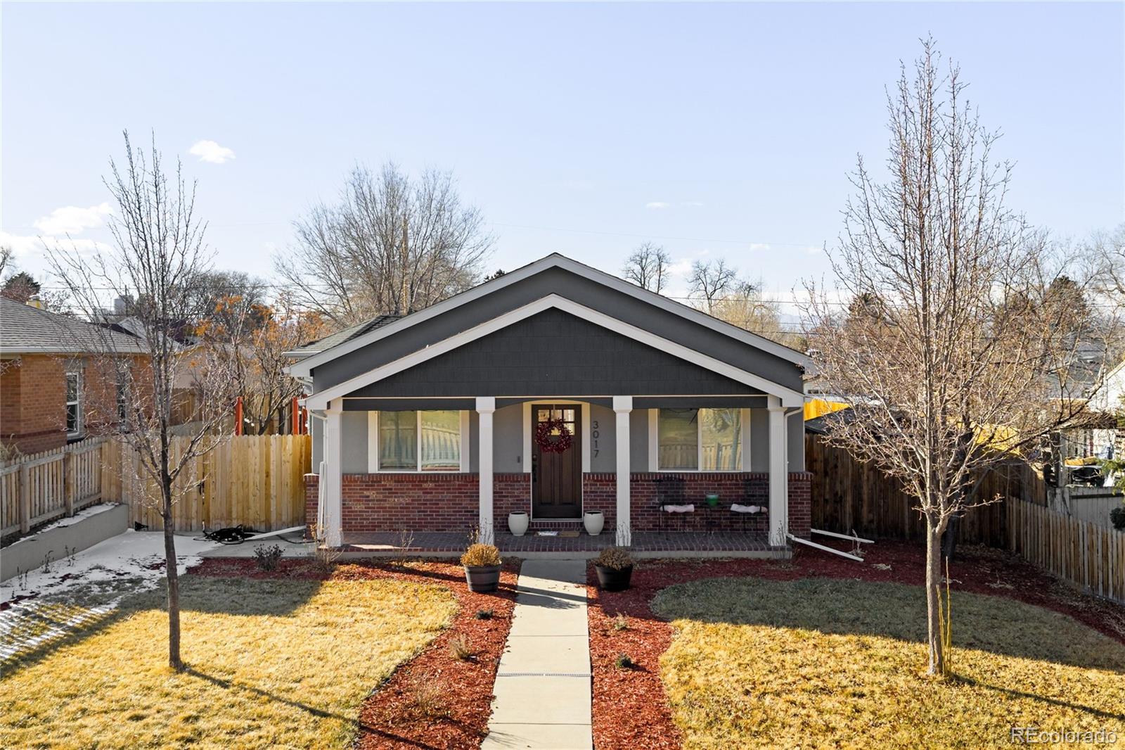 3017 Steele Street Denver, CO 80205 - Photo 29 of 36 a view of a house with backyard porch and sitting area