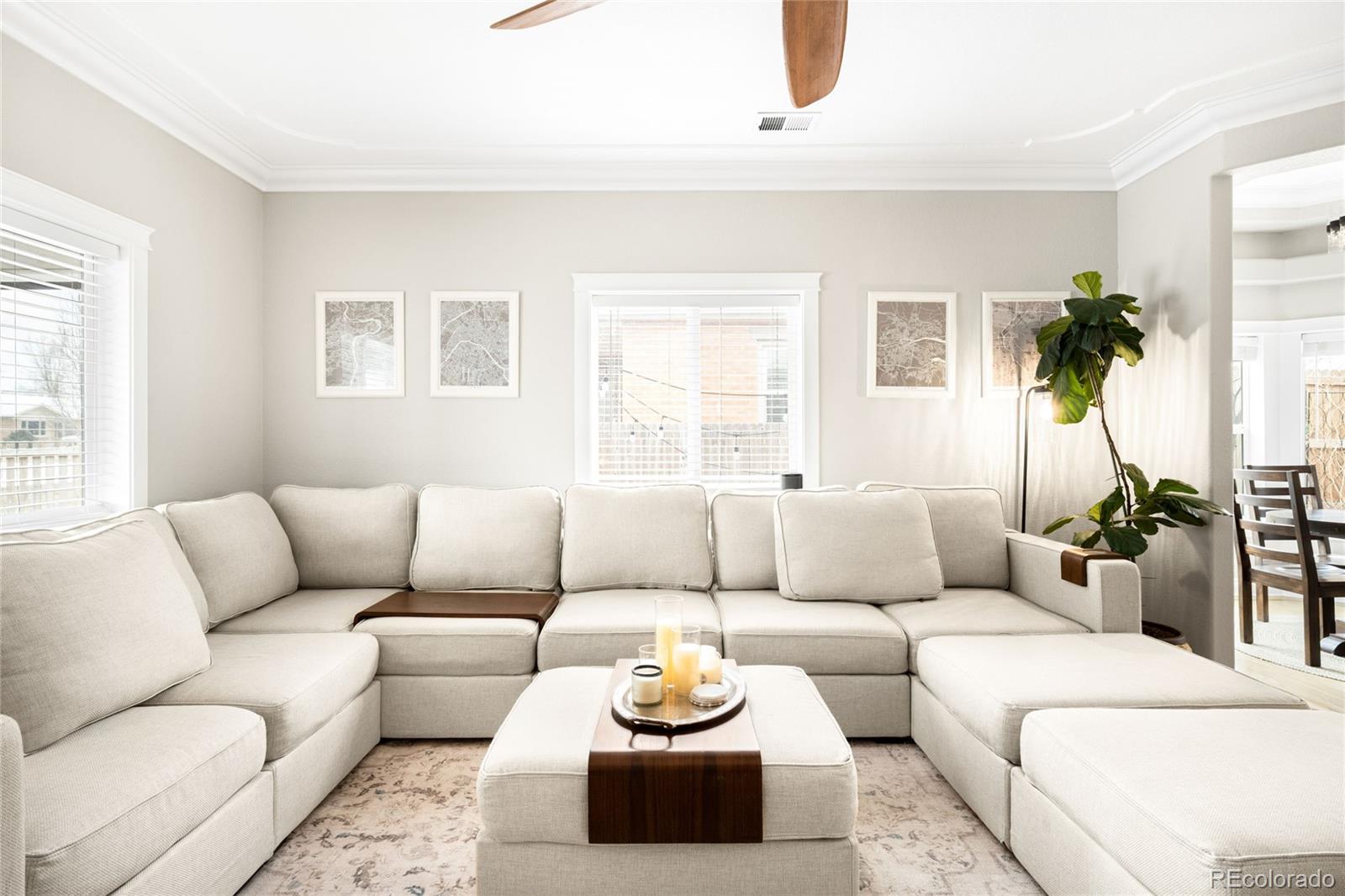 3017 Steele Street Denver, CO 80205 - Photo 4 of 36 a living room with furniture and a large window
