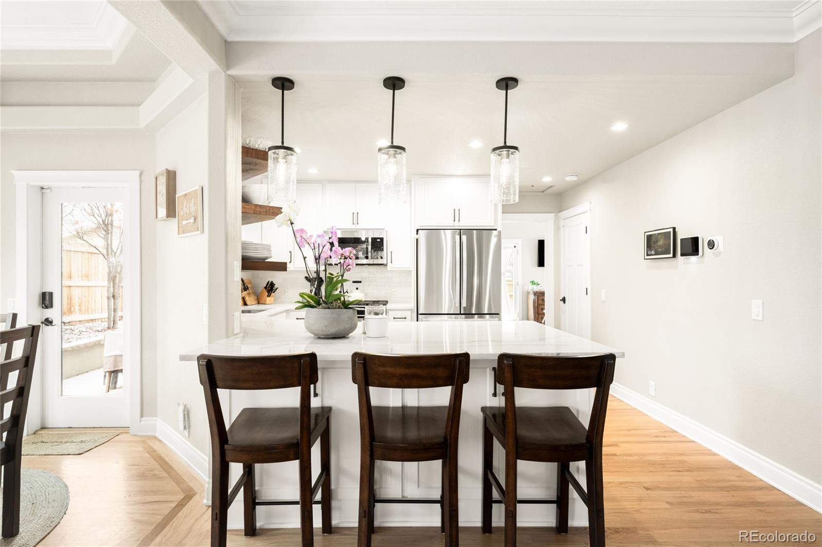 3017 Steele Street Denver, CO 80205 - Photo 6 of 36 a dining room with furniture and window