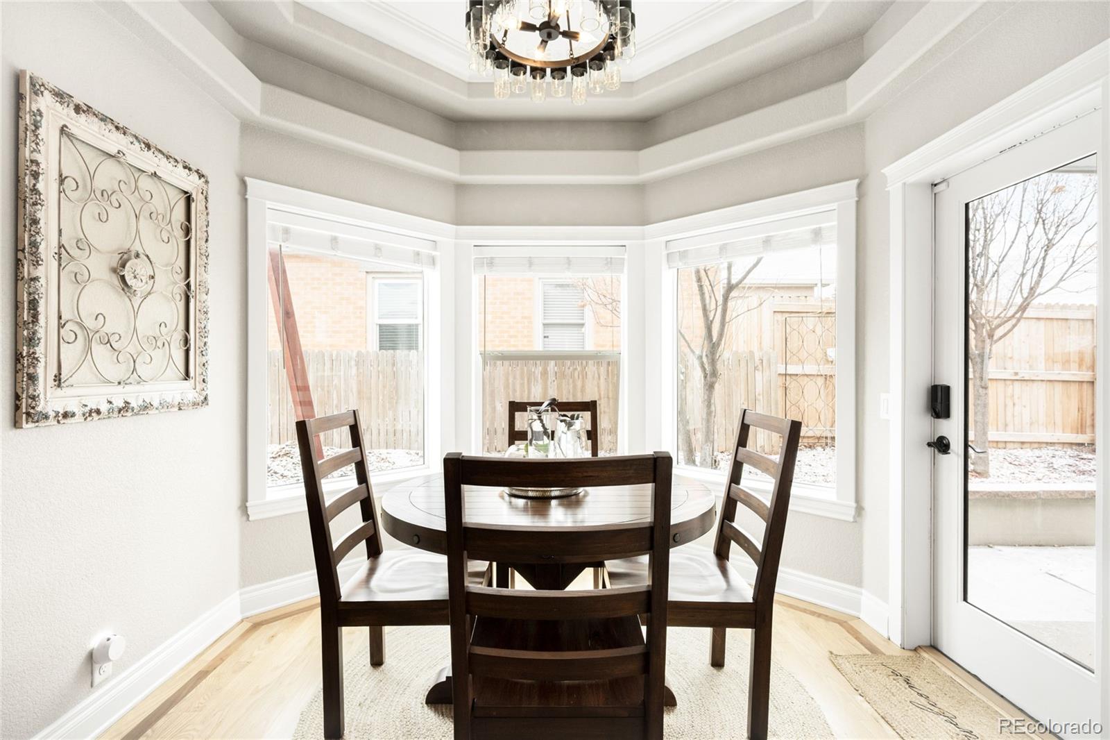 3017 Steele Street Denver, CO 80205 - Photo 9 of 36 a view of a dining room with furniture window and outside view