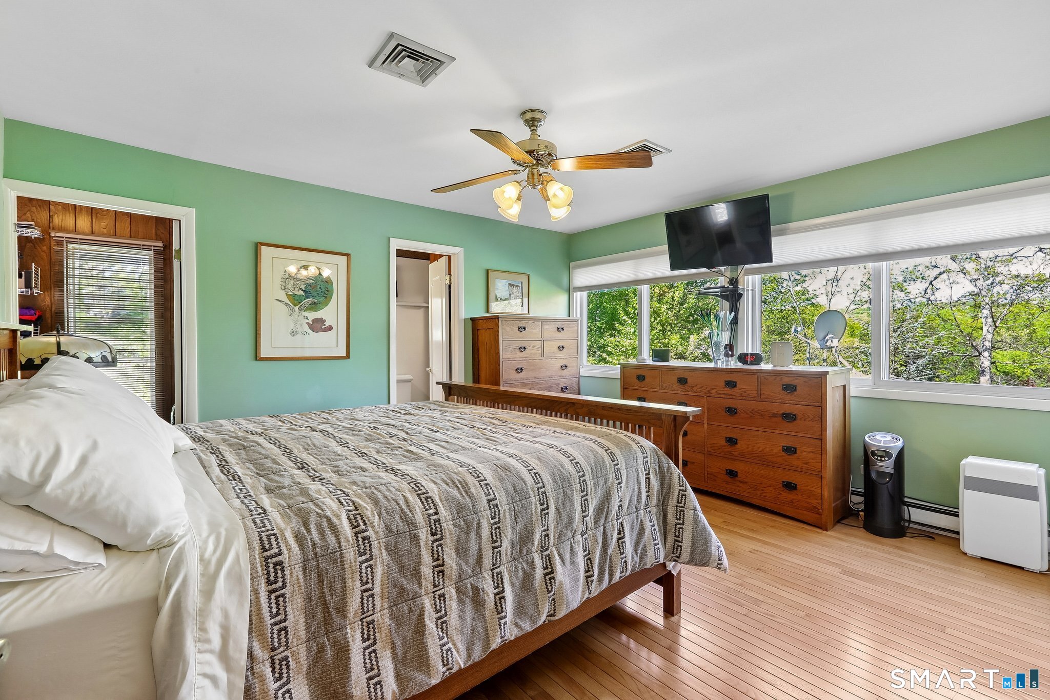 4 Alan Road Danbury, CT 06810 - Photo 15 of 38 a bedroom with a bed and wooden floor