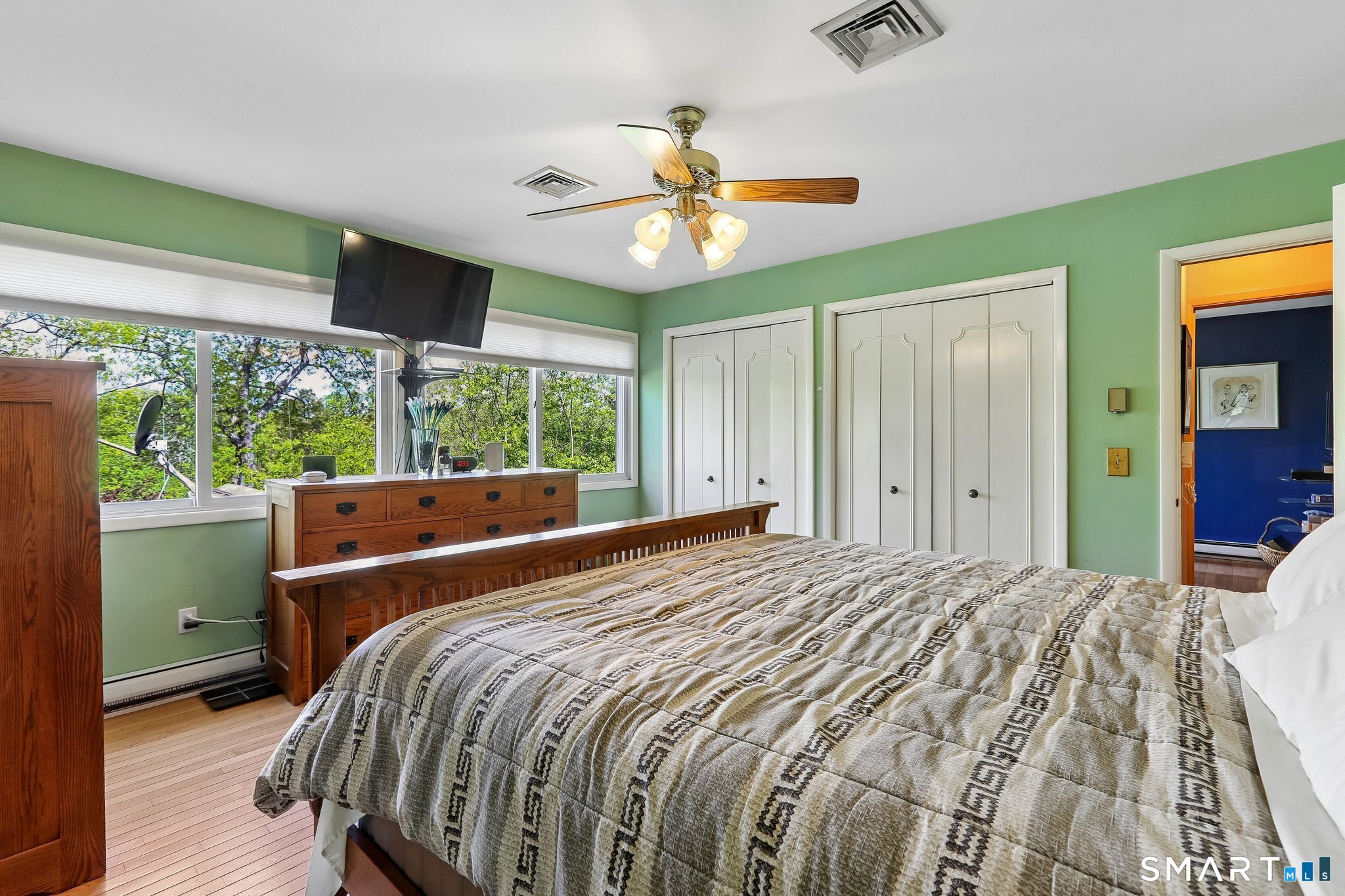 4 Alan Road Danbury, CT 06810 - Photo 16 of 38 a bedroom with a bed and a chandelier
