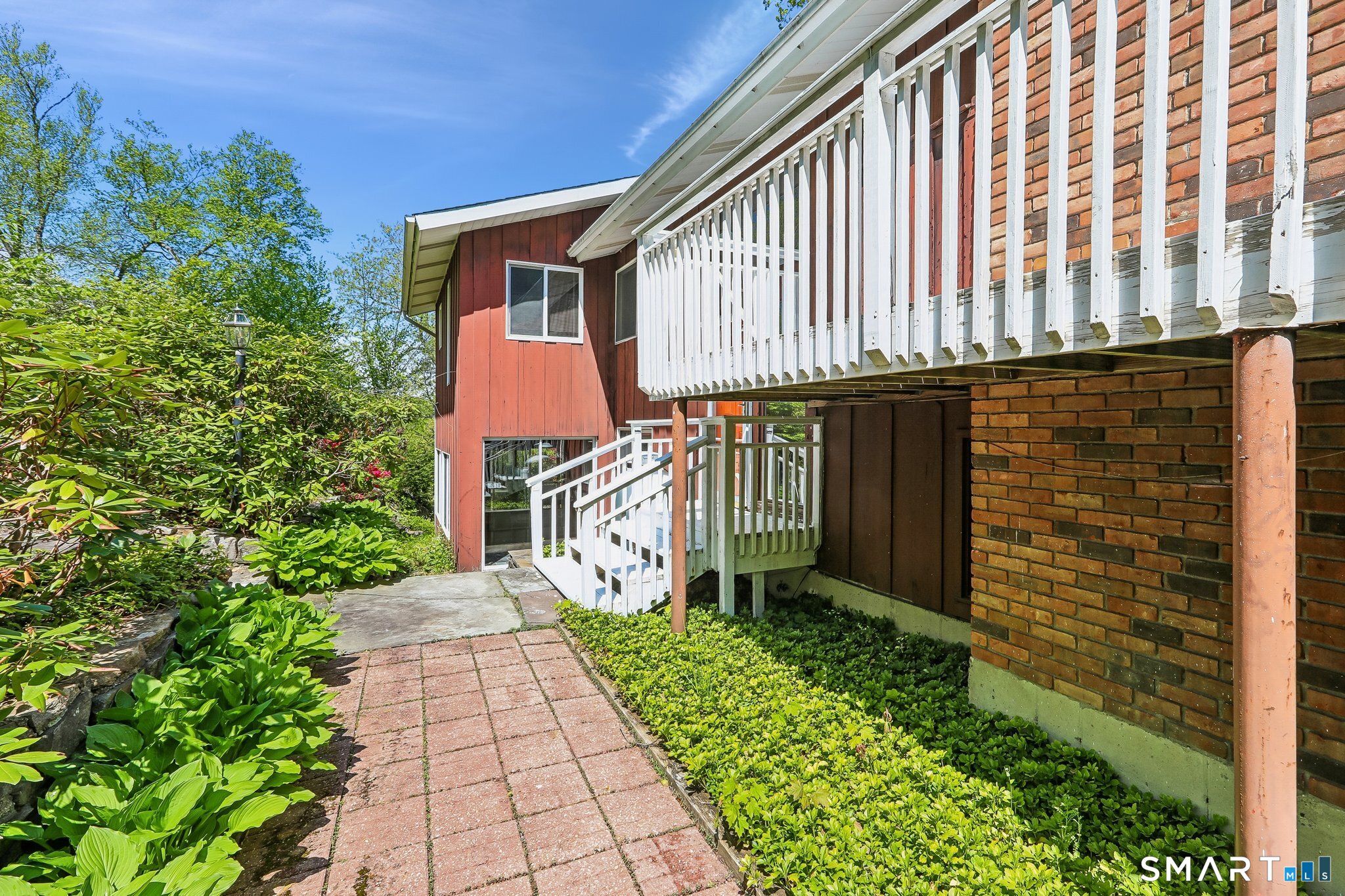 4 Alan Road Danbury, CT 06810 - Photo 29 of 38 a front view of a house with garden