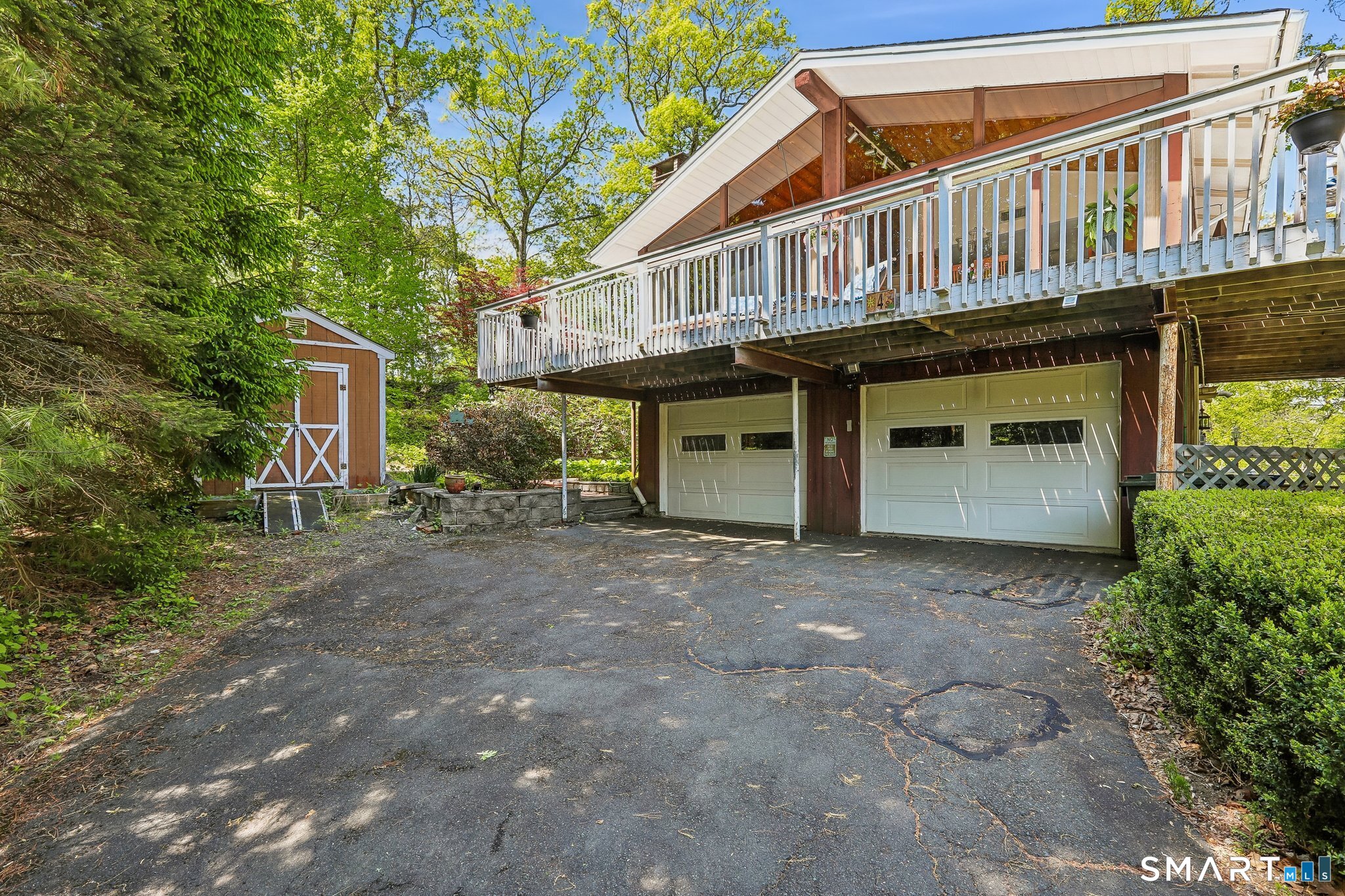4 Alan Road Danbury, CT 06810 - Photo 30 of 38 a view of a house with large windows and plants