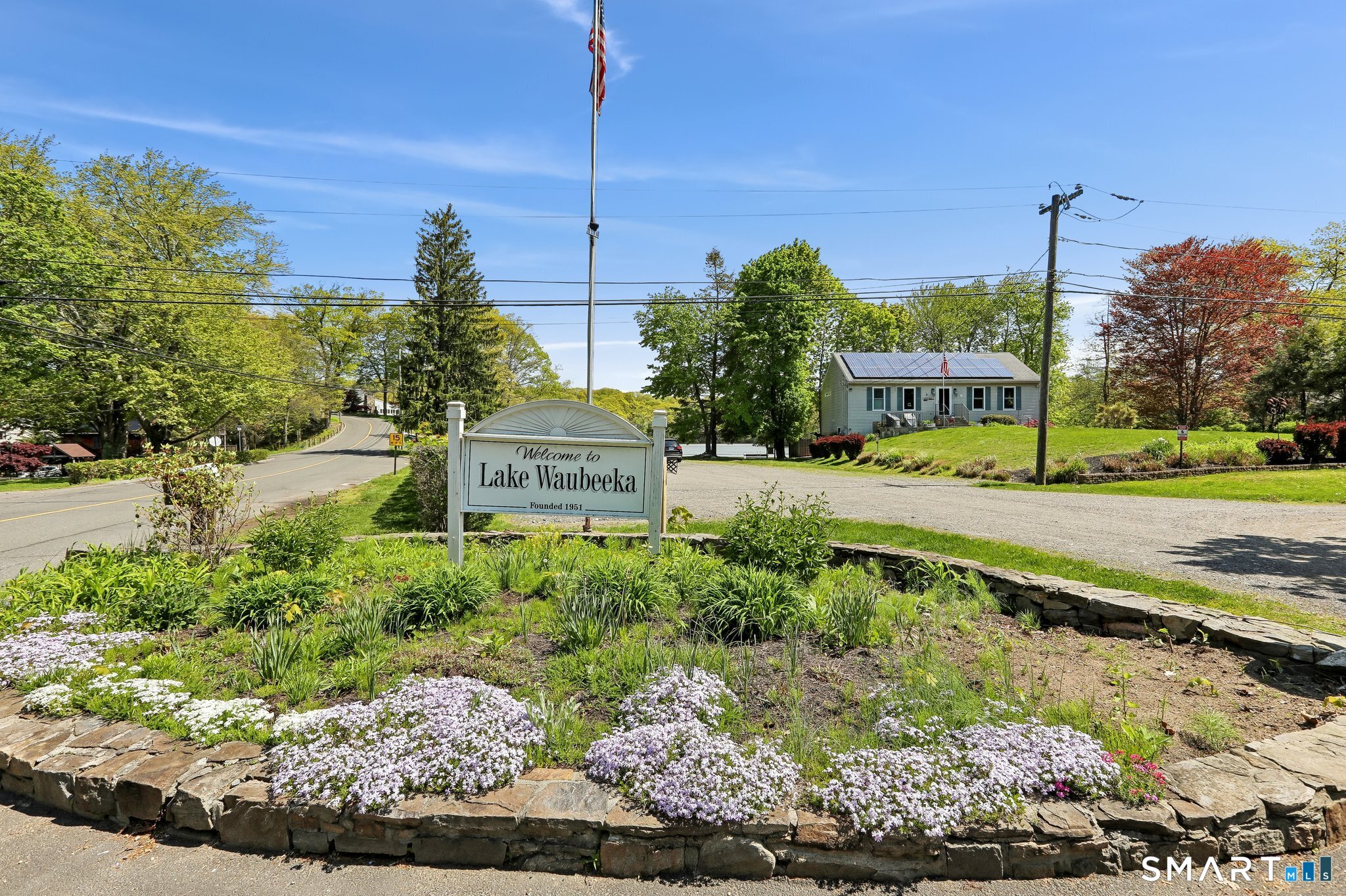 4 Alan Road Danbury, CT 06810 - Photo 34 of 38 a view of a garden with a building in the background