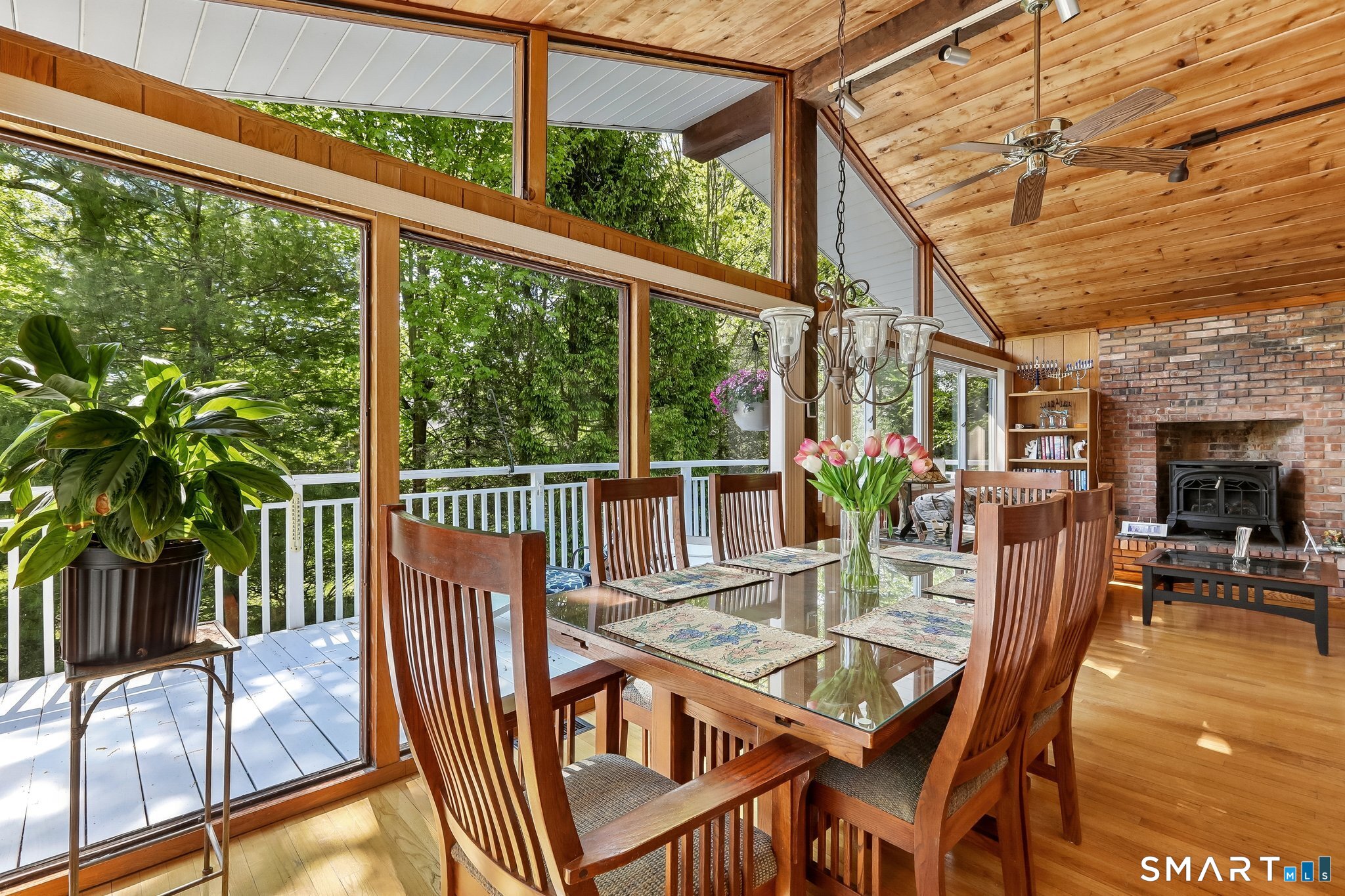 4 Alan Road Danbury, CT 06810 - Photo 7 of 38 a view of a patio with a table chairs and a floor to ceiling window