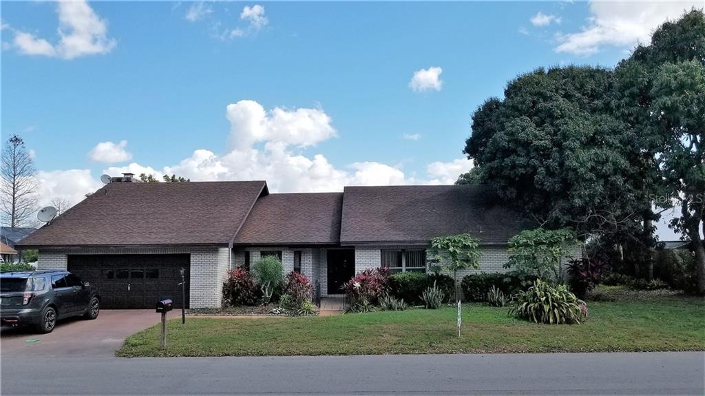 292 Hernando Road Winter Haven, FL 33884 - Photo 1 of 1 a front view of a house with a yard and garage
