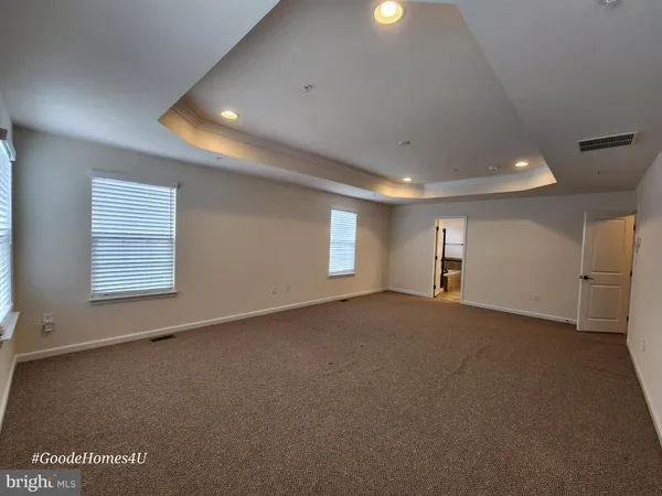 a view of empty room with windows