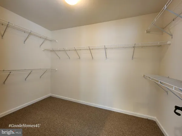 a view of a room with racks on the wall