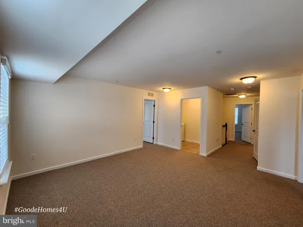 a kitchen with stainless steel appliances kitchen island granite countertop a sink and a stove
