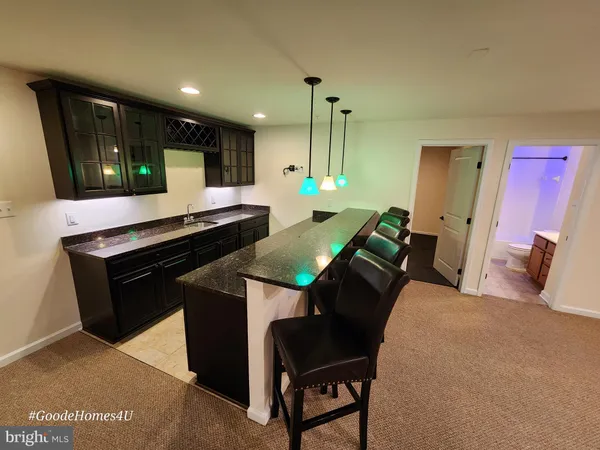 a view of empty room with a fireplace